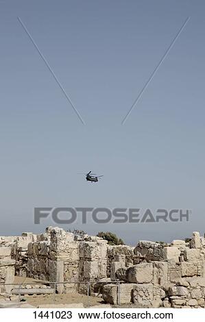 Helicopter flying over old ruins View Large Photo Image Stock Image - Helicopter flying over old ruins. Fotosearch