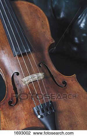 High angle close-up of violin on table View Large Photo Image Stock Image - High angle close-up of violin on table. Fotosearch