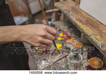 High angle view of artist mixing paint in palette at studio View Large Photo Image Stock Photo - High angle view of artist mixing paint in palette at studio. Fotosearch