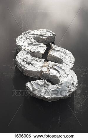 Stock Photography - High angle view of broken concrete section sign on table. Fotosearch