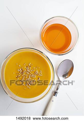 High angle view of carrot puree and drink with spoon over white background View Large Photo Image Stock Photo - High angle view of carrot puree and drink with spoon over white background. Fotosearch