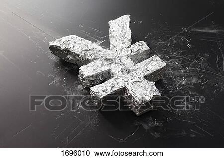 High angle view of concrete currency symbol on black table View Large Photo Image Stock Image - High angle view of concrete currency symbol on black table. Fotosearch