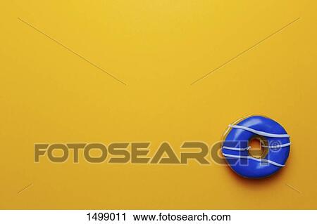 High angle view of donut on yellow background View Large Photo Image Stock Image - High angle view of donut on yellow background. Fotosearch