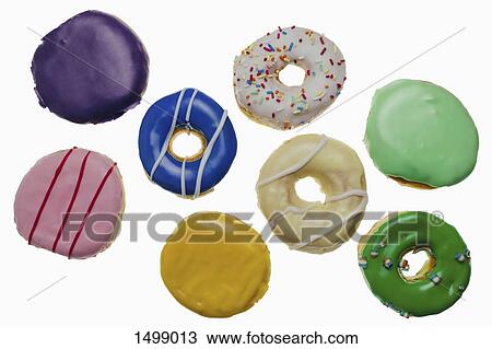 High angle view of donuts on white background View Large Photo Image Stock Image - High angle view of donuts on white background. Fotosearch
