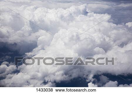 High angle view of fluffy clouds View Large Photo Image Stock Photo - High angle view of fluffy clouds. Fotosearch