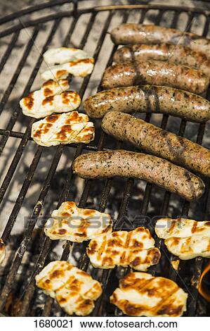 High angle view of food on barbecue grill View Large Photo Image Stock Image - High angle view of food on barbecue grill. Fotosearch