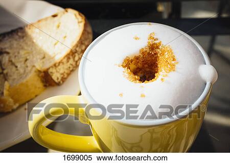 High angle view of fresh frothy coffee with brown sugar on table at cafe View Large Photo Image Stock Photography - High angle view of fresh frothy coffee with brown sugar on table at cafe. Fotosearch