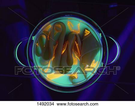 Picture - High angle view of illuminated food in container against blue background. Fotosearch