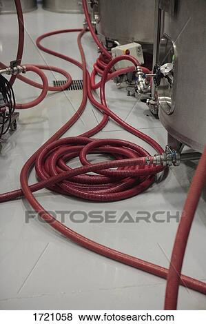 High angle view of industrial hoses connecting to storage tanks View Large Photo Image Stock Photo - High angle view of industrial hoses connecting to storage tanks. Fotosearch