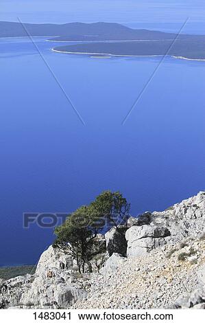 High angle view of lake and mountains View Large Photo Image Stock Image - High angle view of lake and mountains. Fotosearch