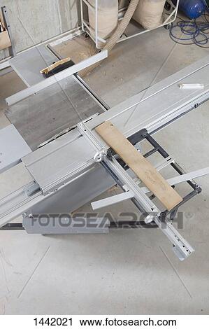 High angle view of lumber on sliding table saw in workshop View Large Photo Image Stock Image - High angle view of lumber on sliding table saw in workshop. Fotosearch