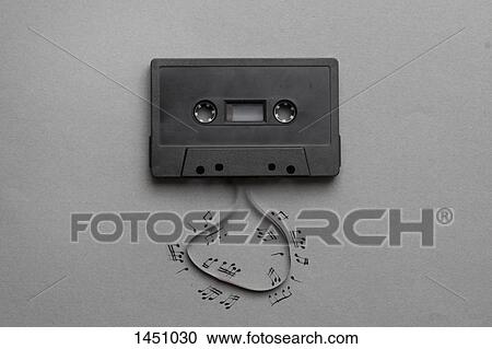High angle view of music notes drawn around cassette reel on gray background View Large Photo Image Stock Image - High angle view of music notes drawn around cassette reel on gray background. Fotosearch