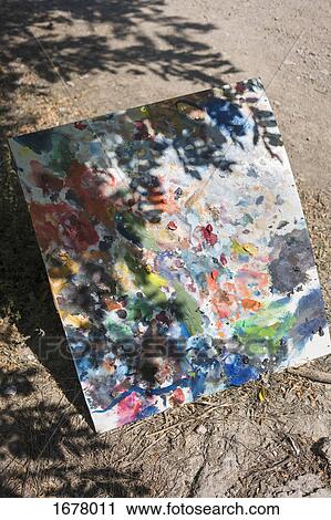High angle view of painted canvas on ground during sunny day View Large Photo Image Stock Image - High angle view of painted canvas on ground during sunny day. Fotosearch