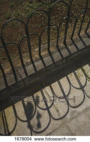 High angle view of railing at park on sunny day View Large Photo Image Picture - High angle view of railing at park on sunny day. Fotosearch