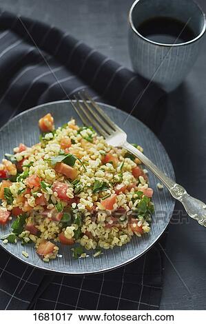 High angle view of rice with chopped tomatoes in plate on napkin View Large Photo Image Stock Photo - High angle view of rice with chopped tomatoes in plate on napkin. Fotosearch
