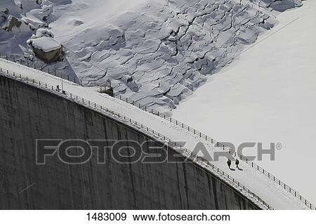 High angle view of snow covered dam and frozen reservoir View Large Photo Image Stock Photo - High angle view of snow covered dam and frozen reservoir. Fotosearch