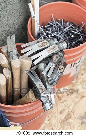 High angle view of various equipment in bucket by wall View Large Photo Image Stock Photography - High angle view of various equipment in bucket by wall. Fotosearch