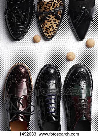 High angle view of various formal shoes on metal grate View Large Photo Image Stock Image - High angle view of various formal shoes on metal grate. Fotosearch