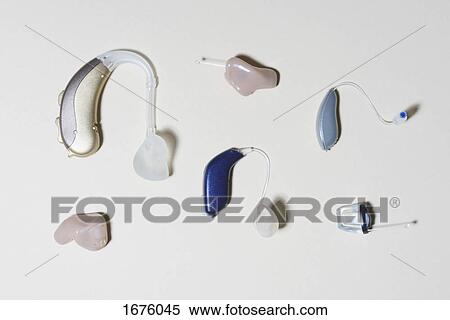 High angle view of various hearing aids arranged on table View Large Photo Image Stock Photography - High angle view of various hearing aids arranged on table. Fotosearch