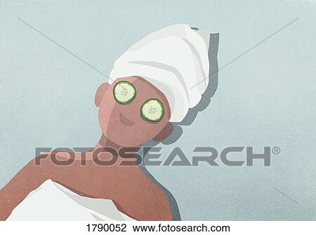 High angle view of woman with hair wrapped in towel and cucumber covering eyes View Large Photo Image Stock Image - High angle view of woman with hair wrapped in towel and cucumber covering eyes. Fotosearch