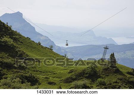 Idyllic view of Swiss Alps in foggy weather View Large Photo Image Stock Image - Idyllic view of Swiss Alps in foggy weather. Fotosearch