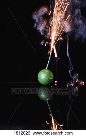 Ignited firework smoke bomb against black background View Large Photo Image Stock Image - Ignited firework smoke bomb against black background. Fotosearch