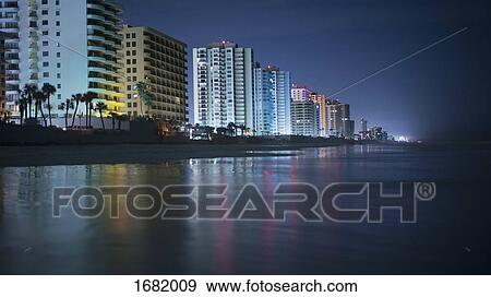 Illuminated buildings by beach in city at night, Daytona, Florida, USA View Large Photo Image Stock Photo - Illuminated buildings by beach in city at night, Daytona, Florida, USA. Fotosearch