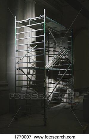 Illuminated scaffolding in dark museum View Large Photo Image Stock Photo - Illuminated scaffolding in dark museum. Fotosearch
