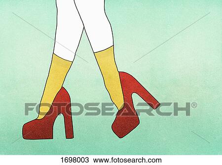 Stock Image - Illustrative image of woman wearing red high heels against green background. Fotosearch