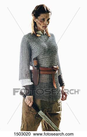 Injured woman wearing chain mail holding sword against white background View Large Photo Image Stock Image - Injured woman wearing chain mail holding sword against white background. Fotosearch