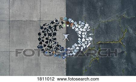 Stock Image - Knolling of man surrounded by color coded clothing wardrobe. Fotosearch