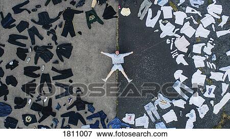 Knolling portrait man surrounded by color coded clothing wardrobe View Large Photo Image Stock Photo - Knolling portrait man surrounded by color coded clothing wardrobe. Fotosearch