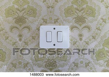 Light switch on patterned wall View Large Photo Image Stock Image - Light switch on patterned wall. Fotosearch