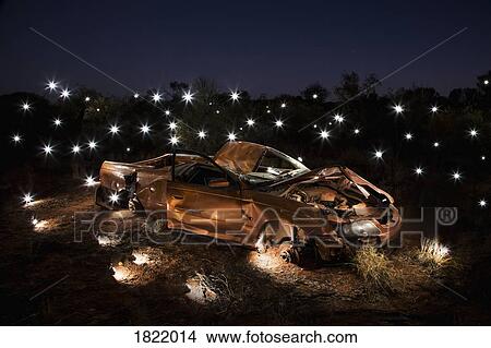 Lights illuminating art installation of crushed car View Large Photo Image Picture - Lights illuminating art installation of crushed car. Fotosearch
