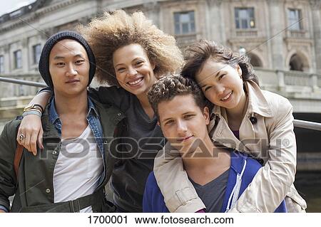 Low angle portrait of smiling young multi-ethnic friends against Bode Museum, Berlin, Germany View Large Photo Image Stock Image - Low angle portrait of smiling young multi-ethnic friends against Bode Museum, Berlin, Germany. Fotosearch