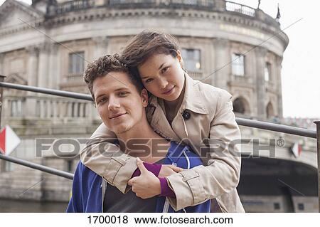 Low angle portrait of woman embracing male friend against Bode Museum, Berlin, Germany View Large Photo Image Stock Photo - Low angle portrait of woman embracing male friend against Bode Museum, Berlin, Germany. Fotosearch