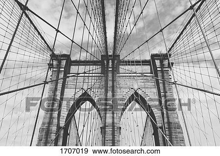 Low angle view of Brooklyn Bridge against sky, New York City, New York, USA View Large Photo Image Stock Photo - Low angle view of Brooklyn Bridge against sky, New York City, New York, USA. Fotosearch