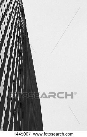 Low angle view of building against clear sky View Large Photo Image Stock Photo - Low angle view of building against clear sky. Fotosearch