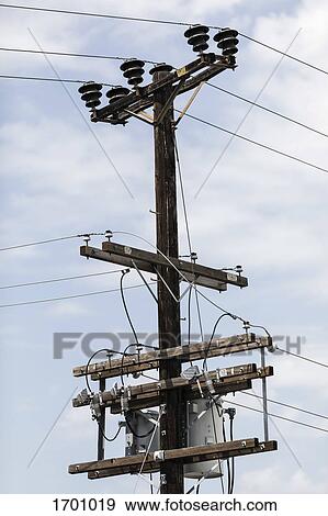 Low angle view of electricity pylon against sky View Large Photo Image Stock Photo - Low angle view of electricity pylon against sky. Fotosearch