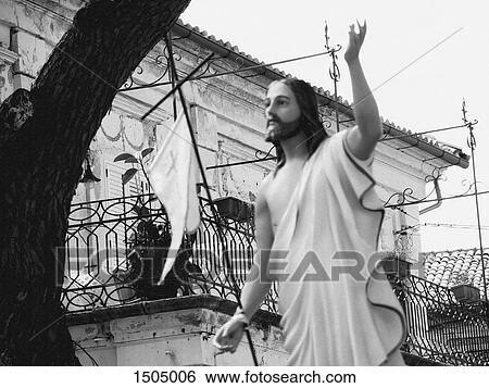 Stock Photograph - Low angle view of Jesus Christ statue against building, Pizzo, Calabria, Italy. Fotosearch
