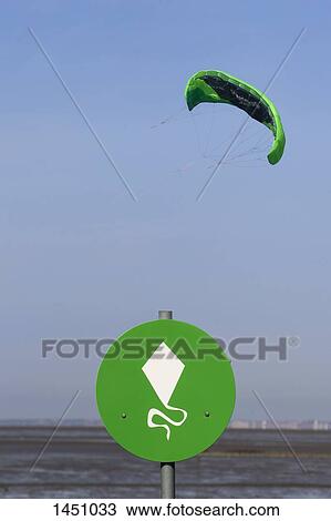 Stock Image - Low angle view of parasail against sky. Fotosearch