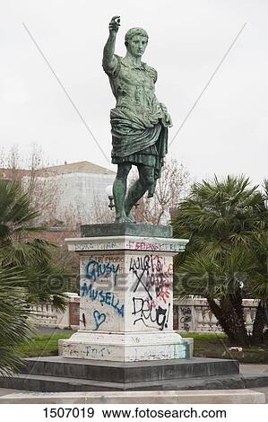 Low angle view of statue with graffiti at park View Large Photo Image Stock Photo - Low angle view of statue with graffiti at park. Fotosearch