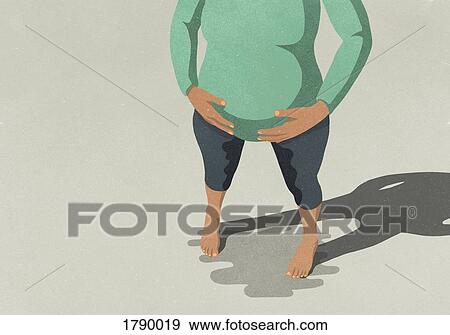 Stock Photo - Low section of pregnant woman standing and going into labor against gray background. Fotosearch