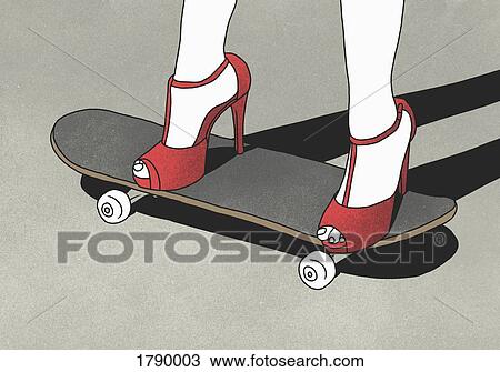 Low section of woman wearing high heels and standing on skateboard View Large Photo Image Stock Image - Low section of woman wearing high heels and standing on skateboard. Fotosearch