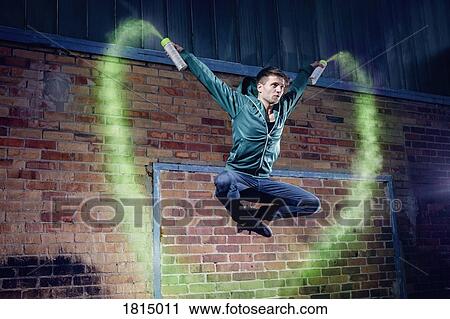 Male modern dancer performing with spray paint View Large Photo Image Stock Image - Male modern dancer performing with spray paint. Fotosearch