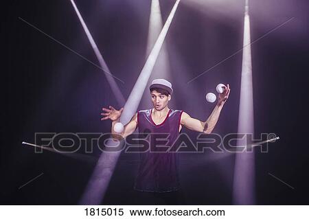Male performer juggling on stage View Large Photo Image Stock Photography - Male performer juggling on stage. Fotosearch