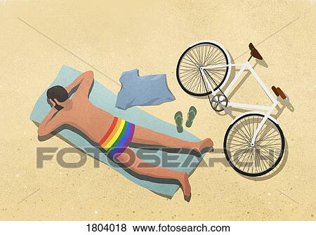 Man in rainbow swim trunks sunbathing on beach towel View Large Photo Image Stock Photo - Man in rainbow swim trunks sunbathing on beach towel. Fotosearch