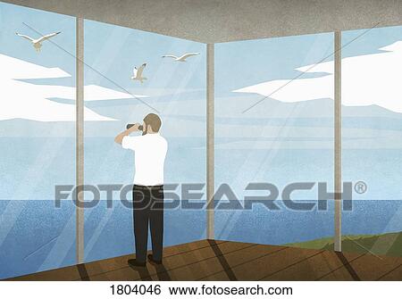Man with binoculars enjoying ocean view from beach house View Large Photo Image Stock Photograph - Man with binoculars enjoying ocean view from beach house. Fotosearch