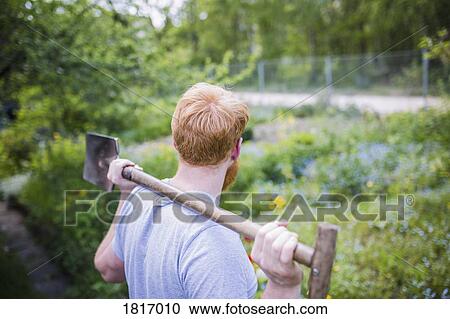 Man with shovel in garden View Large Photo Image Stock Image - Man with shovel in garden. Fotosearch