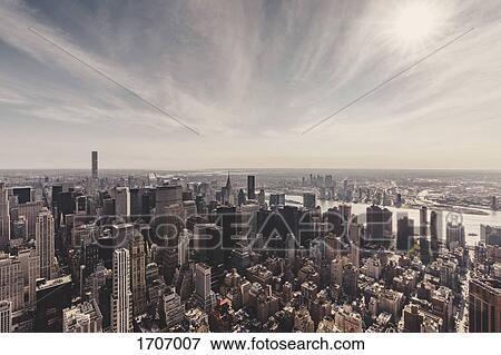 Manhattan and East River against sky seen from Empire State Building, New York City, New York, USA View Large Photo Image Stock Photo - Manhattan and East River against sky seen from Empire State Building, New York City, New York, USA. Fotosearch